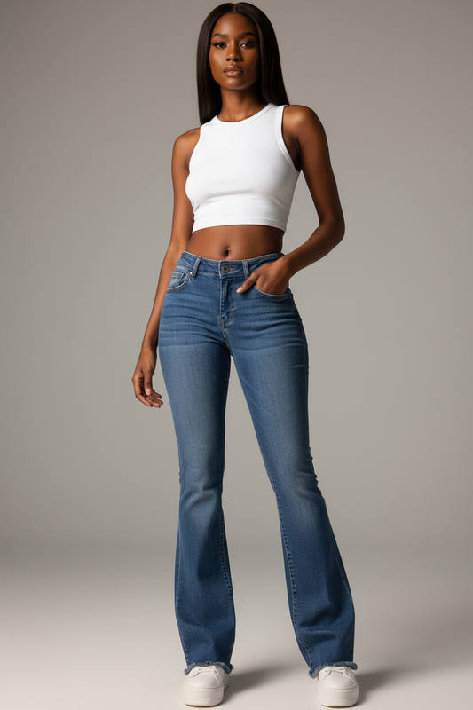 Bell of the Ball medium blue wash bootcut flare jean, West African model full face, bold editorial studio shot